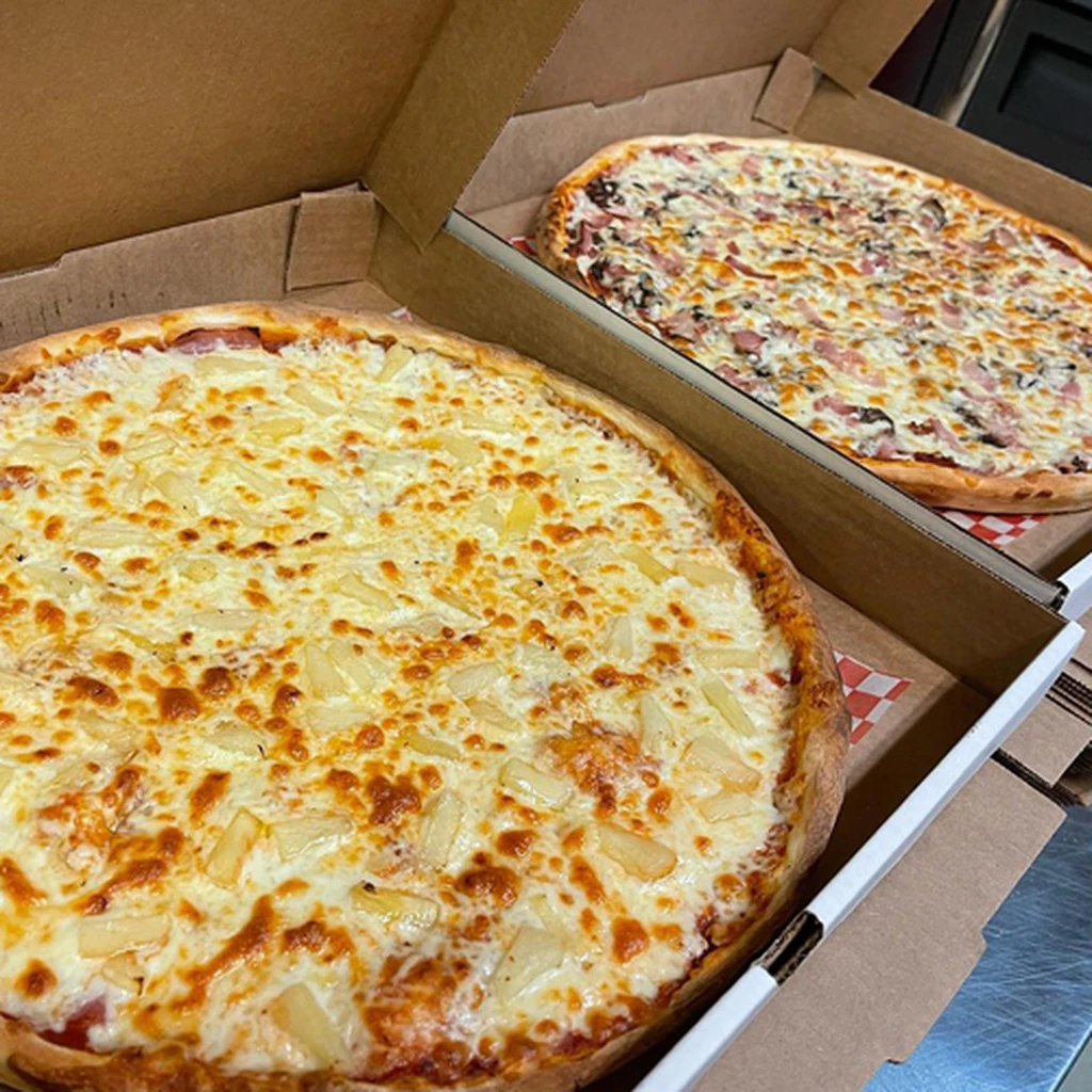 Handmade specialty pizza with premium toppings at Triple C Pizzeria in St. James, Winnipeg