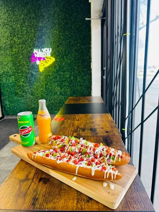 Signature loaded rollZ at Triple C Pizzeria in St. James, Winnipeg - foot-long garlic butter roll topped with cheddar chipotle sauce, mozzarella, fresh tomato and onion